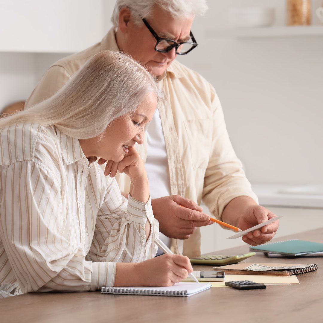 Elderly couple reviewing personal finances